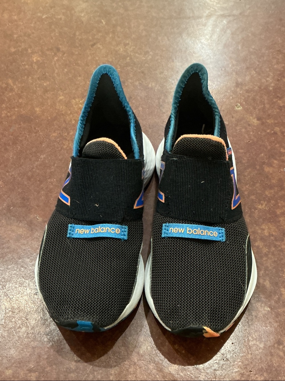 New Balance Kids Black Slip-On Sneakers with Blue and Orange Accents